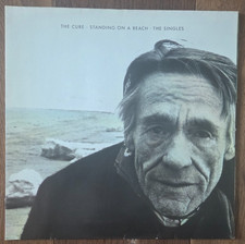 The cure standing a beach - cure,