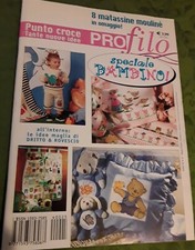 A PUNTO CROCE PROFILO SPECIALE BAMBINO CON SCHEMI ALL'INTERNO A COLORI. 