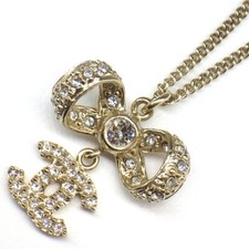 Collana CHANEL Coco Mark 2016 A42647 fiocco strass (strass) metallo placcato oro