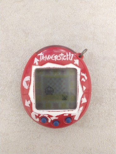 Tamagotchi rosso bianco - rosso, e