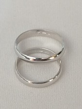 Coppia Fedi Nuziali In Oro Bianco 18 kt Unoaerre Nuove. Peso 5,8gr.