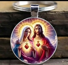 Porte-clés, bijou de sac cabochon Jésus christ et vierge Marie sacré coeur.