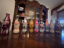 9 bottiglie da collezione coca