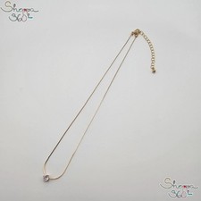 Catenina  di colore oro con pendente punto luce