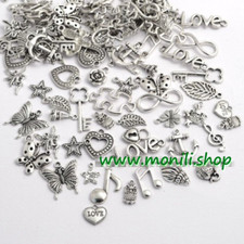 Lotto 50 ciondoli charms, tono argento antico