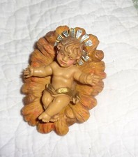 Culla in legno intagliato