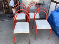quattro sedie vintage in metallo rosso