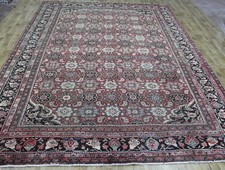 ANTICO TAPPETO DI LANA PERSIANA FATTO A MANO, DESIGN TRADIZIONALE BOTEH, CIRCA 1900.