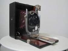 fotocamera a soffietto con treppiedi telescopico