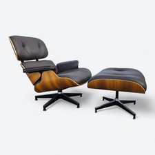 Poltrona e pouf Herman Miller Eames in marrone e noce originali