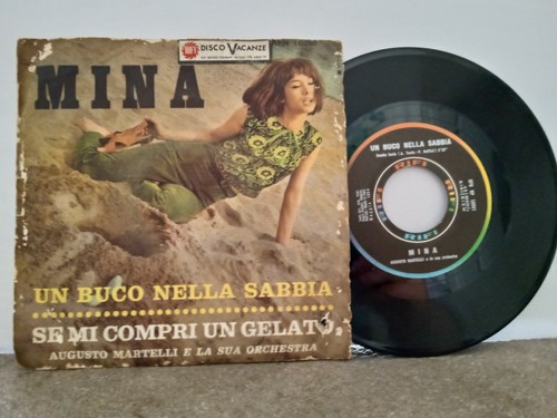 Mina buci nella sabbia - -,