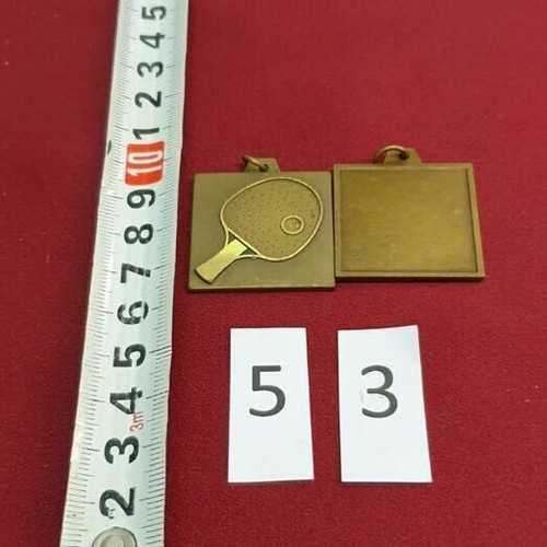 Medaglia metallo dorato - in,