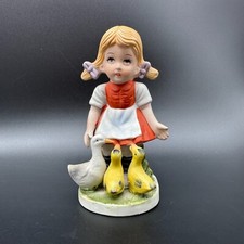 Antica statuina in porcellana