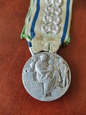 Medaglia Famiglie Numerose. 9 Fiocchi(Figli).Regia Zecca. 34mm.Per Collezionisti