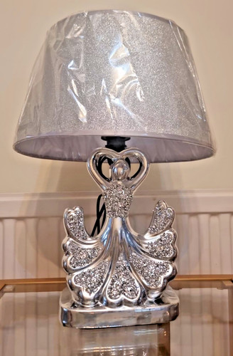 Lampada argento statua