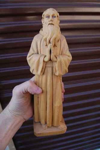 Wood carved statue - +, st