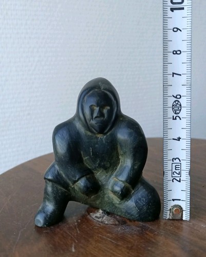 Inuit art figure seated - a,