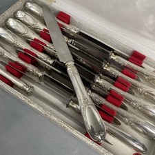 12 couteaux métal argenté 12