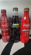 3 coca-cola bottles see photos