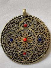Ciondolo tibetano in ottone