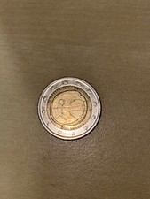 moneta omino stilizzato rara