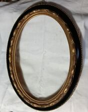 CORNICE OVALE IN STILE, IN LEGNO CON FINITTURA NERA E DORATA DELLA META' DEL'900