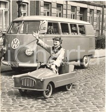 1954 GERMANY The smallest car of the world near a VOLKSWAGEN microbus *Photo