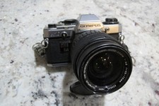 Olympus OM-10 reflex 35 mm con