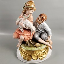 Statuina porcellana oro