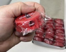 Coca Cola Affilabottiglie