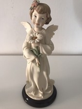Statua Angelo con margherita