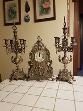 Set candelabri e orologio, anno 1990, in ottone