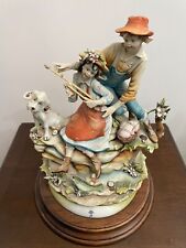 Statua in ceramica di Capodimonte. I Bambini che pescano by Gino Pezzato.