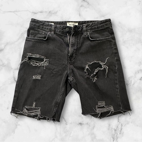 Shorts neri strappati