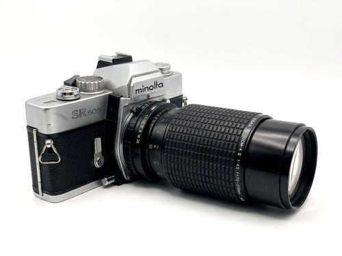 Minolta 505 sigma - +,