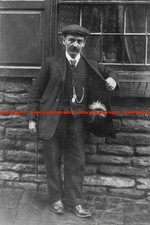 F024173 Vintage shot of veteran WW1 with Maltese cross and Yorkshire terrier GB