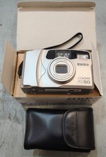 Fotocamera Konica FX-50 analogica con scatola e manuali.