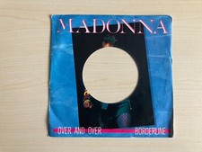 Madonna over and - _, /
