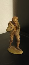 Antica statuina in legno