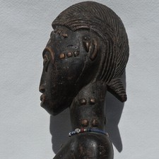an old african female statue