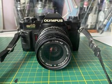 OLYMPUS OM-40 PROGRAM