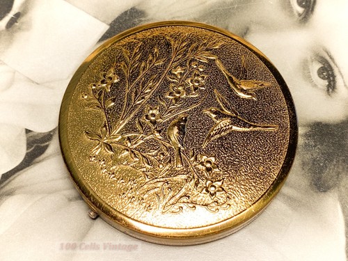 Birds embossed gold tone