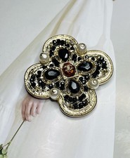 Spilla Chanel tono oro nero