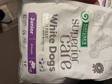 mangime per cuccioli con pelo bianco gusto salmone 