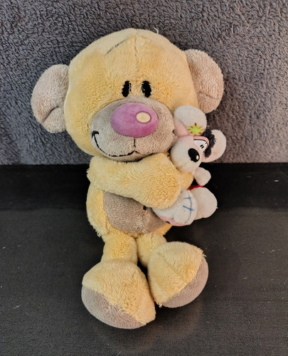 Peluche pimboli qui tient - tient, un