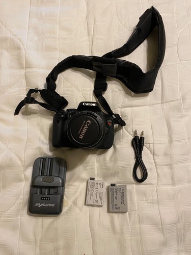 Canon eos rebel - /,