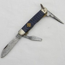 Camillus Cutlery coltello ufficiale CUB SCOUTS BSA, manico in osso blu jigged, 1970°