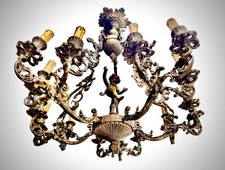 Lampadario barocco in bronzo 15 luci con putto decorativo – antico