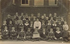 NEWTOWN BOYS' SCHOOL CLASS V - OLD REAL PHOTO WELSH POSTCARD (ref 1739/21/a11)