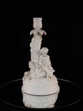 Antico candelabro cherubino